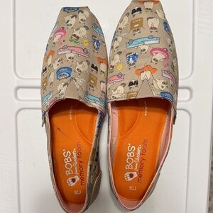 BOBS Orange Slip-On Shoes with Grumpy Cats Print